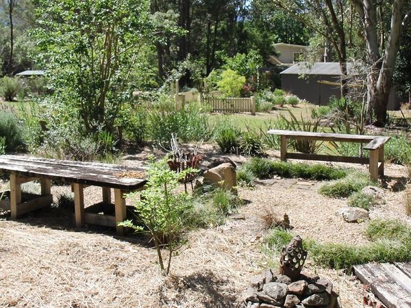 Rustic timber tables in a native garden